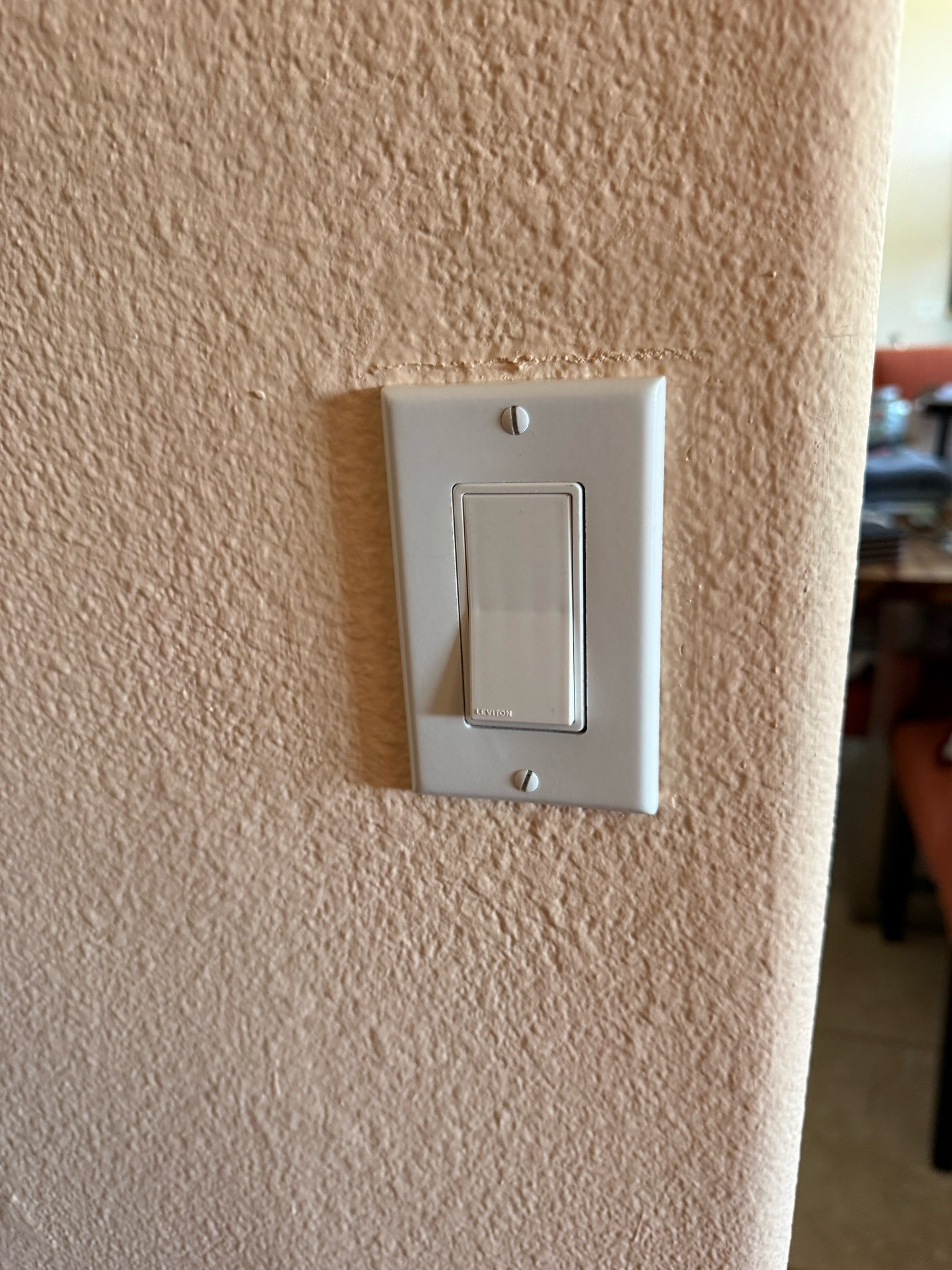 Close-up of the installed white dimmer switch