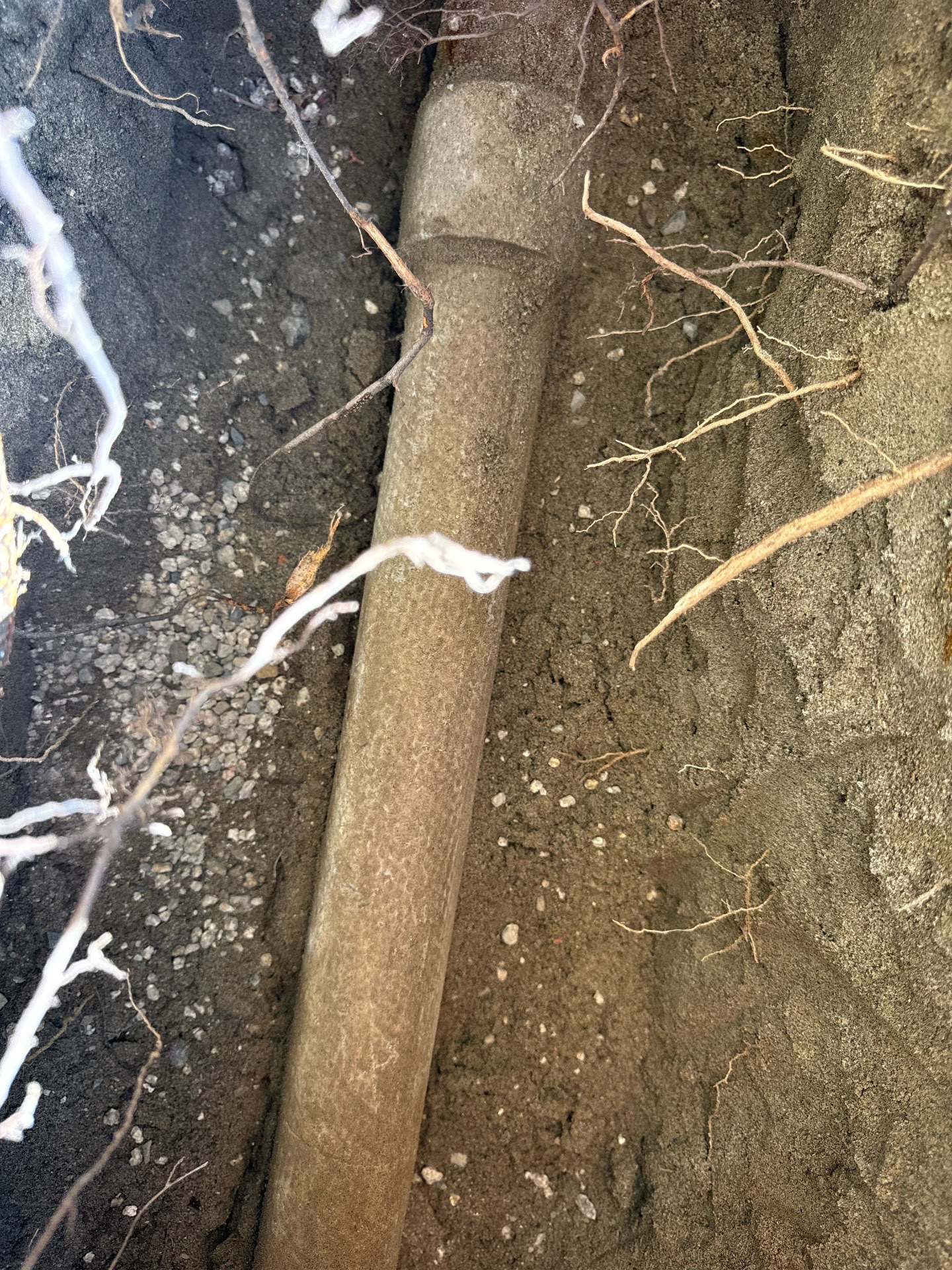 Existing underground raceway exposed for verification during a service investigation