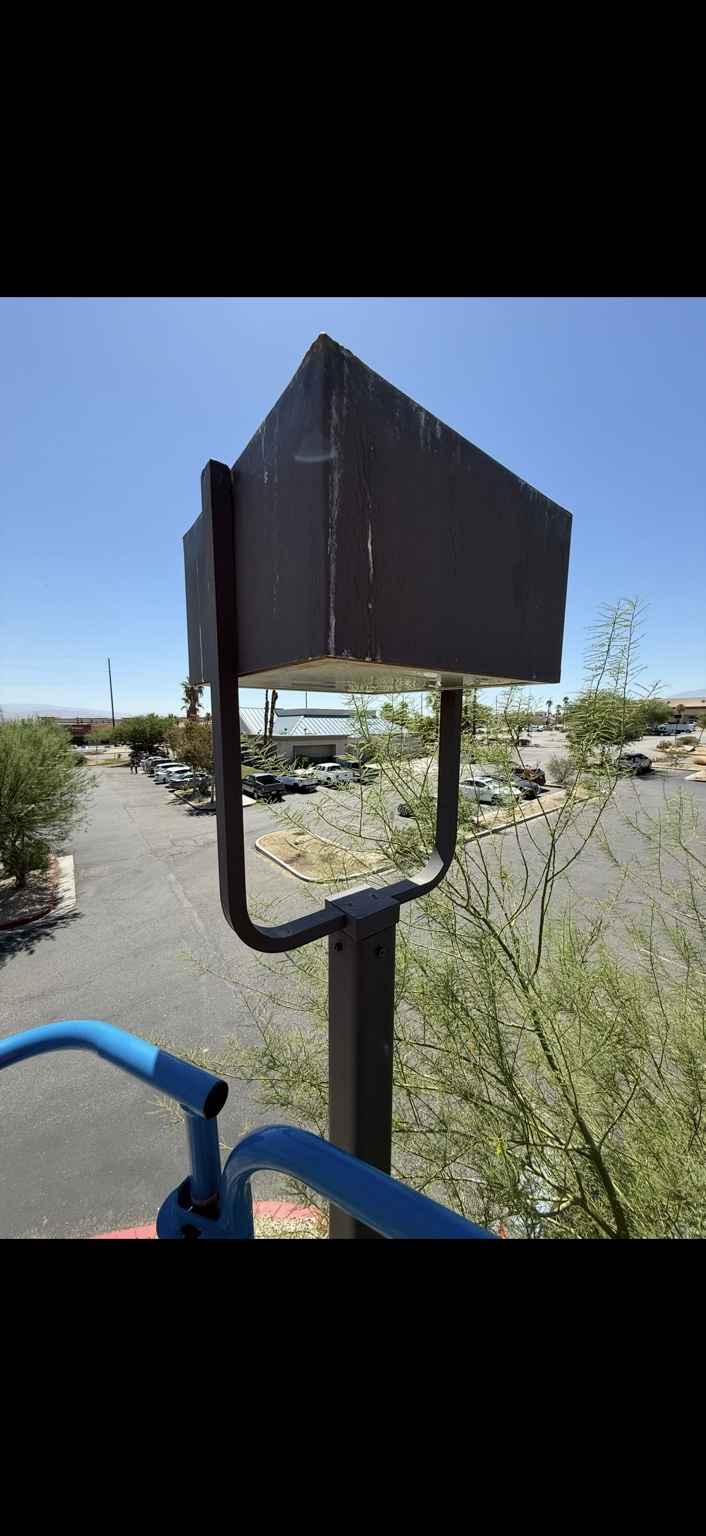 Commercial pole-light fixture viewed from service-lift height