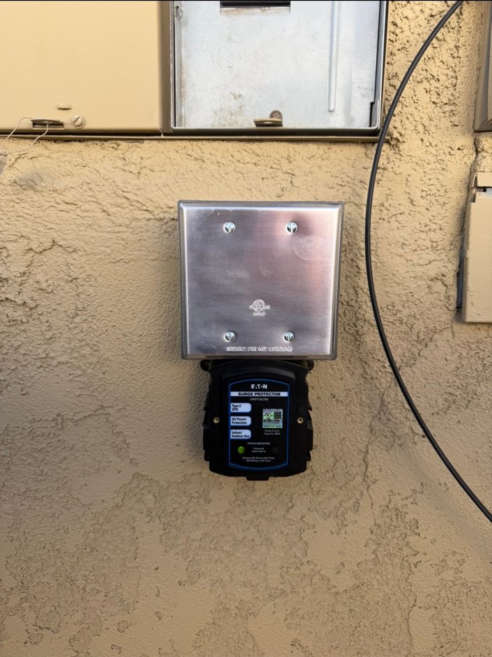 Eaton whole-home surge protector installed beside exterior service equipment